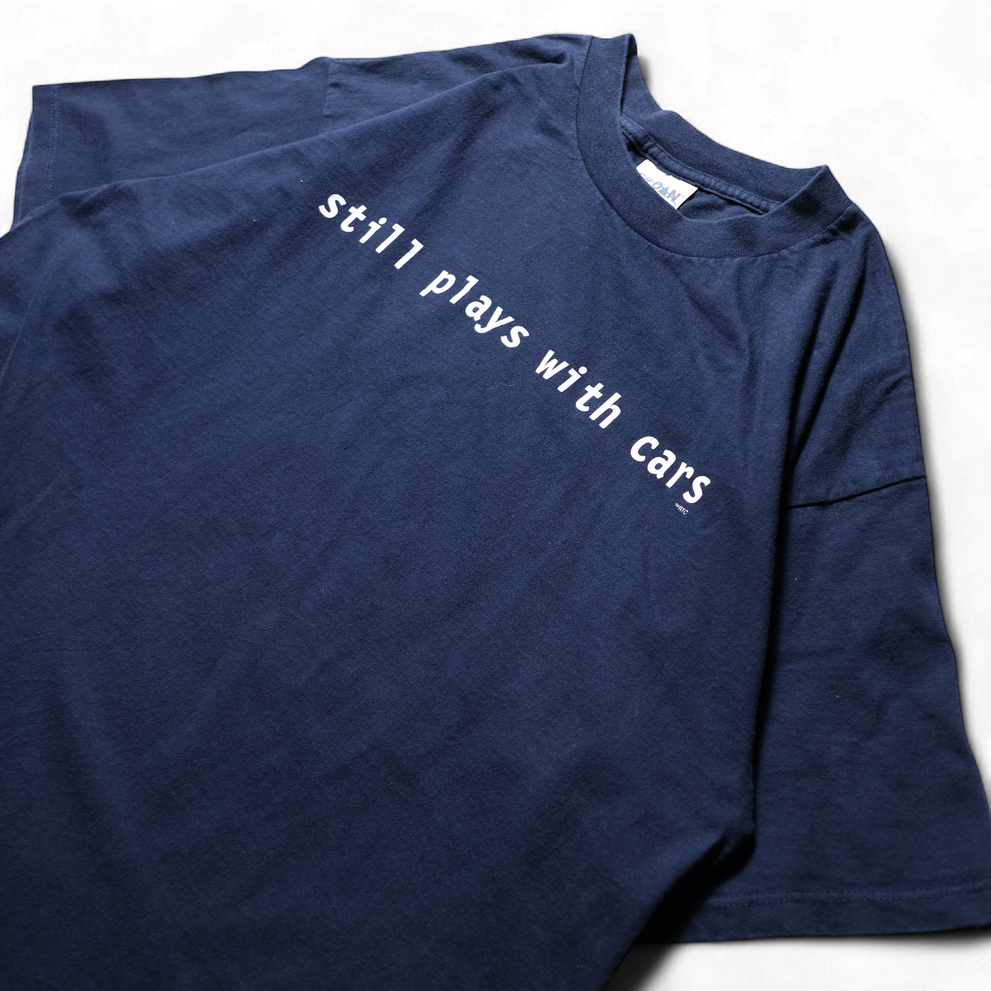 90s Message Tee "still plays with cars"⠀